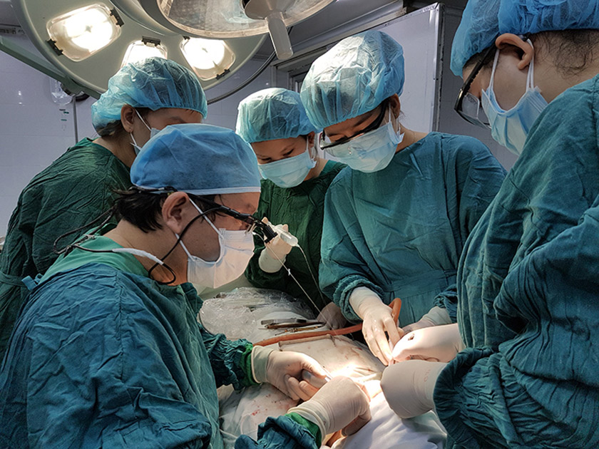 Doctor Vo Van Nhan in the surgery to reposition the nerve for implant placement