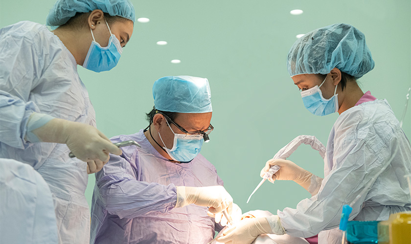 Dr. Vo Van Nhan performing dental implant placement at Nhat Tam Dental Clinic