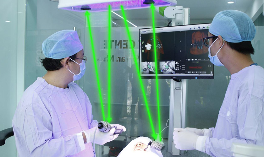 Dr. Vo Van Nhan - Director of Nhan Tam Dental performing dental implant placement