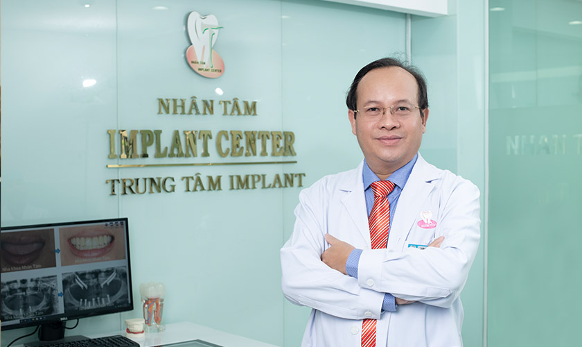Dr. Vo Van Nhan is performing dental implant for a patient