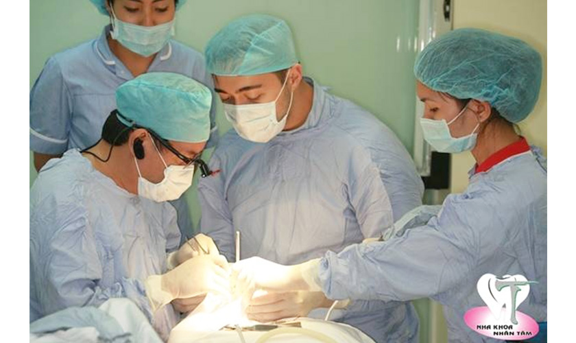 Alexander performing an implant surgery procedure under the guidance of Dr. Vo Van Nhan in 2015