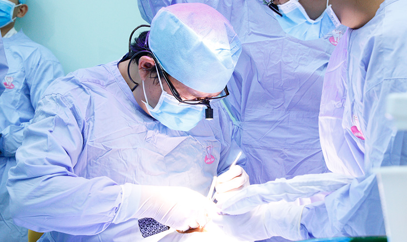 Vo Van Nhan DDS, PhD performs dental implants for patients at Nhan Tam Dental